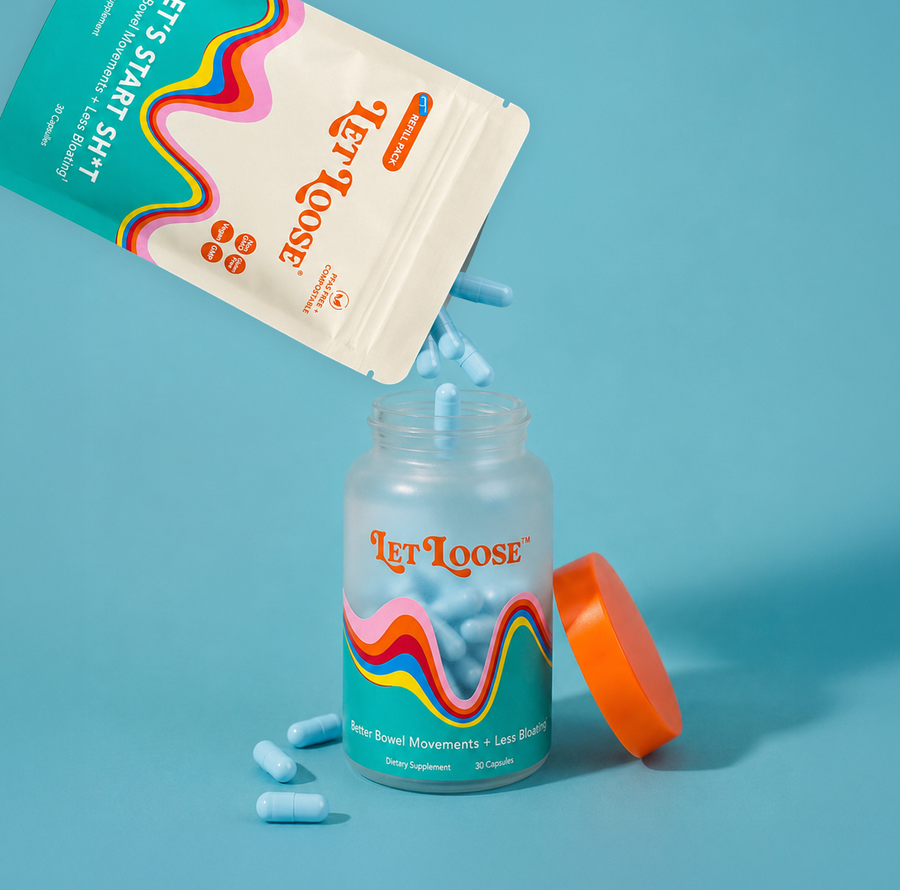A compostable Let Loose refill bag pouring capsules into a glass Let Loose bottle